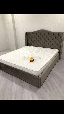 Elegant Queen Size Bed with Plush Headboard