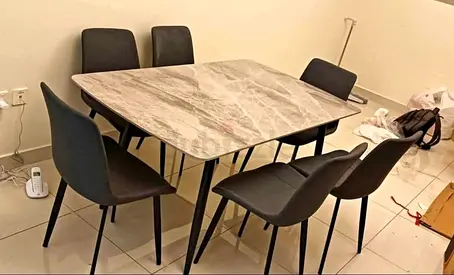 Brand new Top marble dinning table with 6 Chairs Available