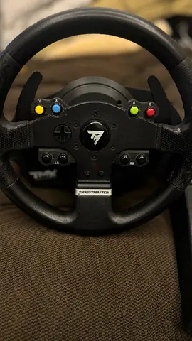 Thrustmaster TMX Pro force feedback racing wheel with T3PA peddles.