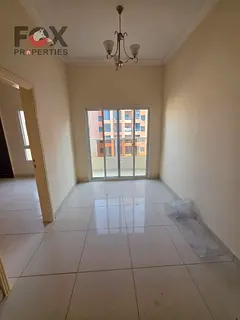 Spacious 1-bedroom master apartment with balcony and open view; prime central Ajman location near al