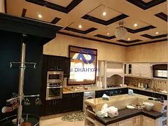 Villa for sale in Al Qurain, a distinctive corner villa on two streets, opposite the park and next t