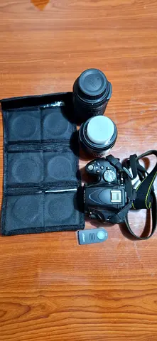 Nikon D5100 with 18-55 mm, 55-200 lens, filters and bag for sale