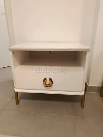 Chic White Nightstand with Gold Accents