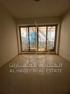 Apartment for rent in Sharjah - Al Nahda  Close to Dubai Exit  Two-bedroom apartment with a practica