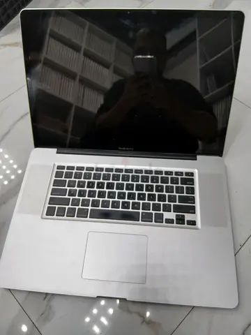 Apple MacBook core 2 duo, 4/500 with charger. 17 inch screen size. Model 1297