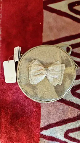 Chic Silver Bow-Detail Handbag