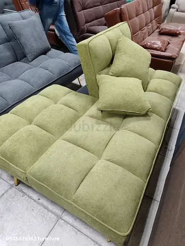 Comfortable Green Sofa with Cushions