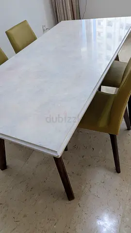 Elegant White Dining Table with Comfortable Chairs