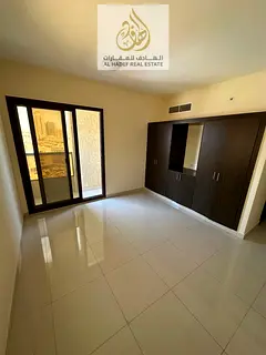 Two rooms and a hall for annual rent with built-in wardrobes in Al Naimiyah