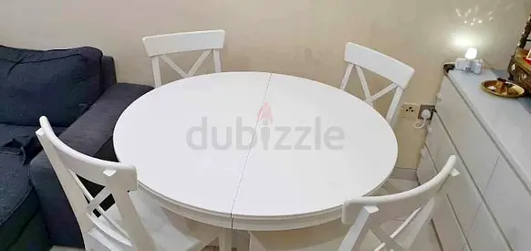 IKEA extendable dining table with 4 chairs