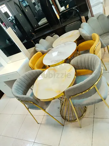 Elegant Round Dining Table Set with Plush Chairs