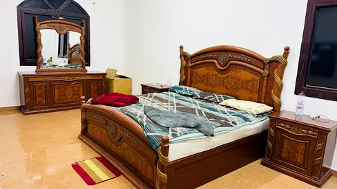 Luxurious King size bed with mattress and side table and dressing table