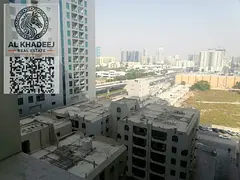 A room and a hall with a balcony and free parking in Al Nuaimiya 3, City Towers, easy access to Duba