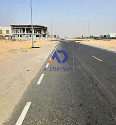 A prime family home opportunity: a distinctive plot of land for sale in Al-Hawshi, with front and ba