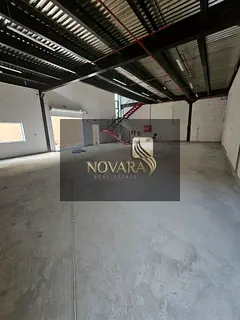 For rent in Ajman, Al Jurf Industrial Area 1, a 3600 sq ft warehouse with a mezzanine, two internal
