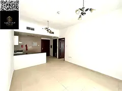 Most beautiful 1BR + Hall for annual rent in City Tower, Ajman, with balcony, 2 bathrooms, kitchen,