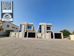Villa for sale in Al Muwaihat 2, Ajman. 5 master bedrooms, majlis, living room with kitchen and maid