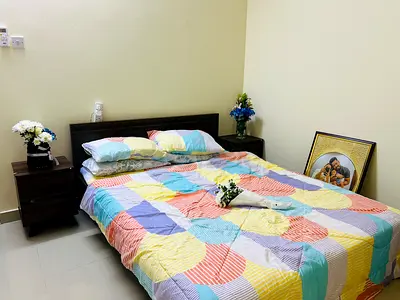 Cozy and Colorful Queen Bed with Nightstands