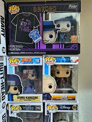 Collection of Funko Pop! Figures including Batman and Unique Characters