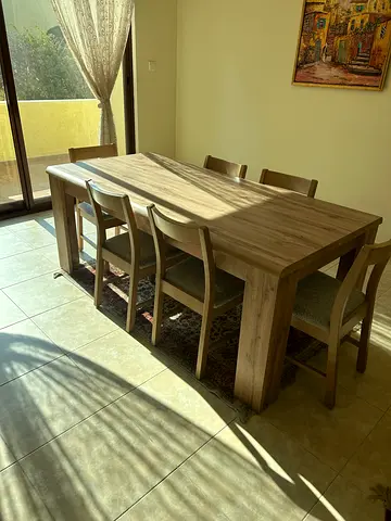 Sturdy Wooden Dining Table with Four Chairs.