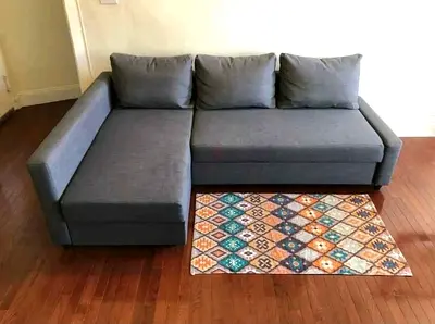 Comfortable L-Shaped Sofa with Colorful Rug
