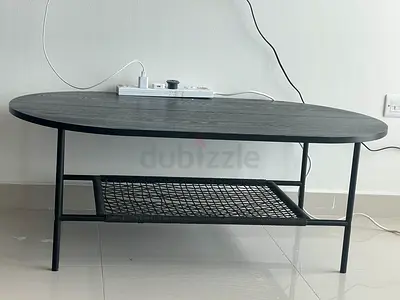Sleek Black Oval Coffee Table with Storage Shelf