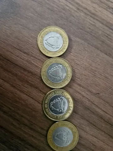 Bahrain 100 fils coins from different years