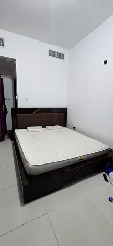 King-size premium solid wood cot, includes a double-sided medicated mattress. Need to remove before