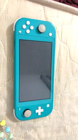 Nintendo switch lite and crash game card for sale in very good condition with 32 gb micro SD card