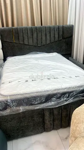 Comfortable Queen Size Bed and Stylish Ottoman