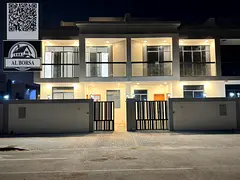 For sale in Al Bahia, a two-story townhouse with a roof terrace, featuring 6 master bedrooms, a livi