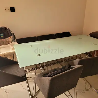 Modern Glass Dining Table with Stylish Chairs
