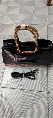 Elegant Black Handbag with Gold Accents