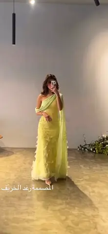 Elegant Yellow Evening Dress with Flowing Cape.