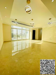 Two-bedroom apartment with a living room and an open view overlooking Sheikh Khalifa Street.