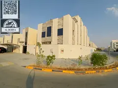 Corner villa for rent in Al Amrah area, Ajman, consisting of 6 master bedrooms, a majlis, a living r