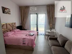 Sharjah - MARIAM ISLAND- Super Deluxe STUDIO , a large living room, a fully equipped kitchen, and ba