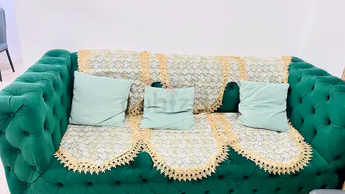 Elegant Green Velvet Sofa with Decorative Covering