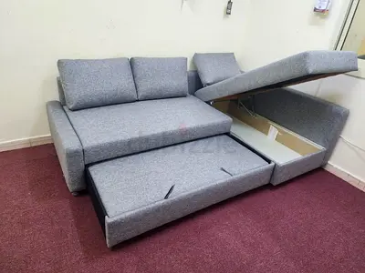IKEA L-shaped sofa com bed with storage
