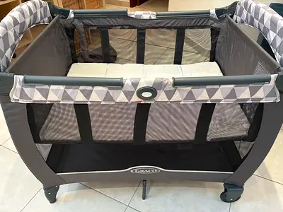 Graco Portable Playard for Your Little One with separate mattress.