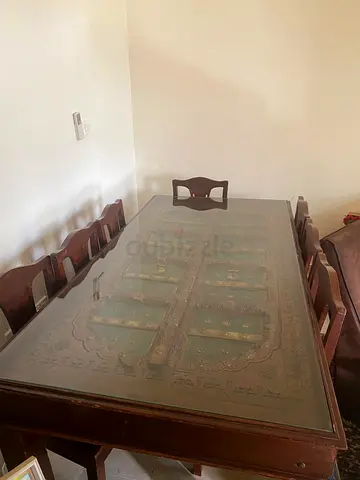 Elegant Wooden Dining Table with Intricate Design