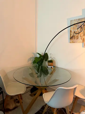 Modern Glass Dining Table with Stylish Accents