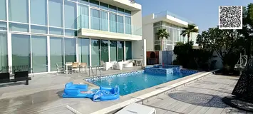Villa for sale in Ajman, Al Zorah area. Two floors + roof. Area: 10,500 sq ft. Freehold ownership fo