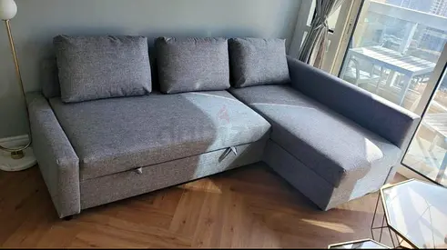 Ikea l shape sofa bed with storage light grey
