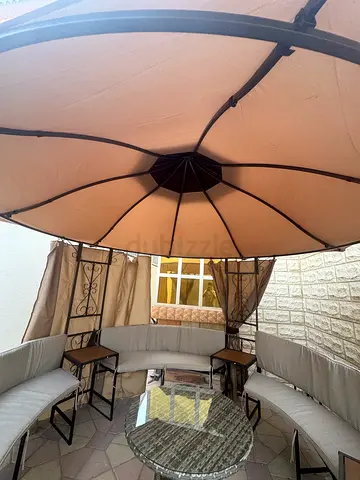 Elegant Outdoor Gazebo with Comfortable Seating