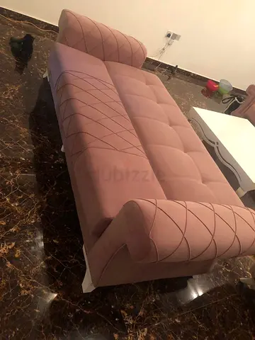 Elegant Pink Lounge Sofa with Stylish Detailing 2 no. Sold only because I bought new.