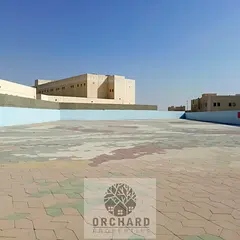 Open yard Ready to move prime location Emirates industrial area al sajaa rent 360k