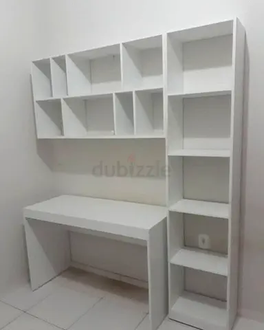 Modern white study table with shelves