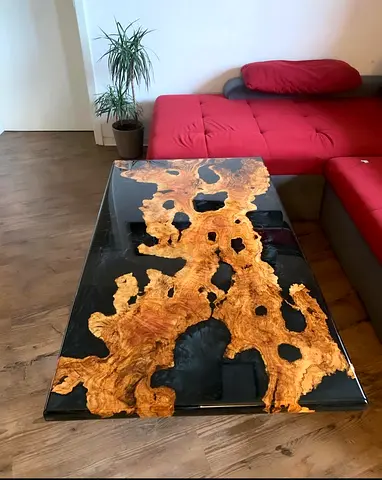 A unique, one-of-a-kind coffee table made from Italian olive wood over 150 years old, combined with