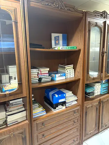 3Elegant wooden cabinet with shelves, drawers, and glass doors. Solid and spacious, perfect for book